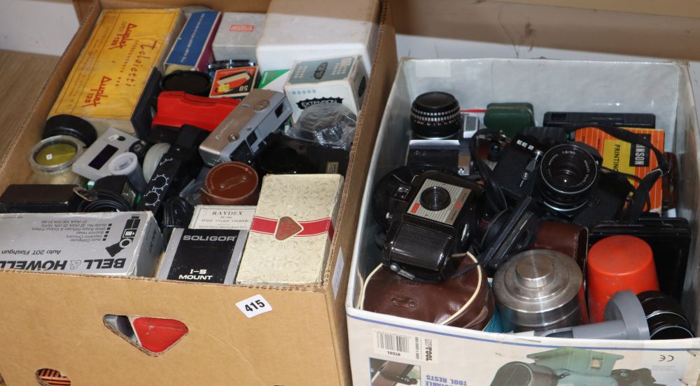 Two boxes of cameras and camera equipment